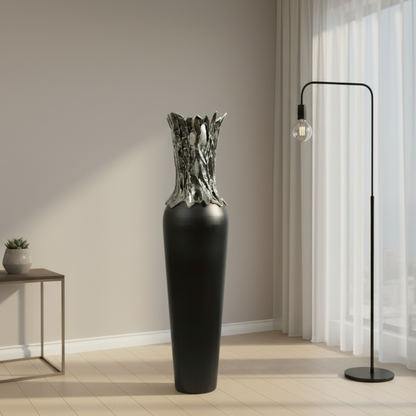 Modern interior with a tall black vase, small table, and floor lamp.