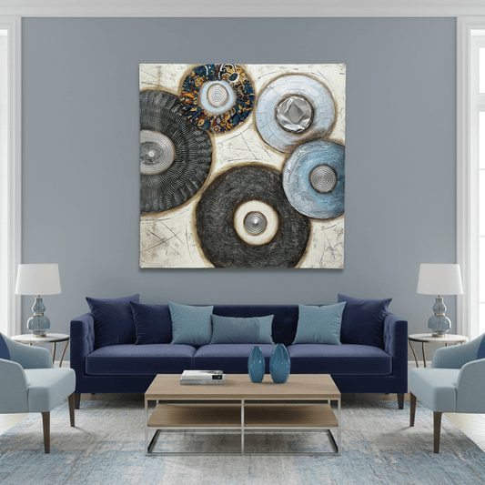 Abstract art piece with circular shapes and metallic textures on a textured surface
