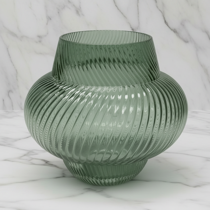 A ribbed, translucent green glass vase with a bulbous shape and a flared neck, photographed on a neutral gray gradient background.