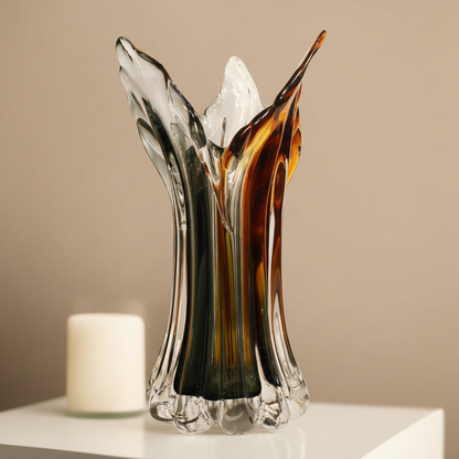 Glass vase with artistic design on a beige background