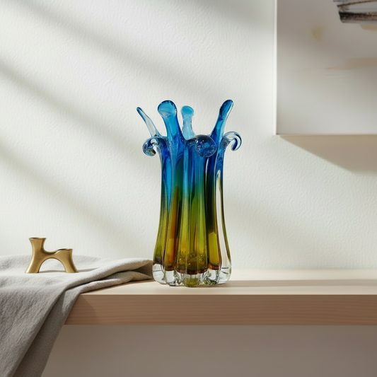 Colorful glass vase on a shelf with a neutral background