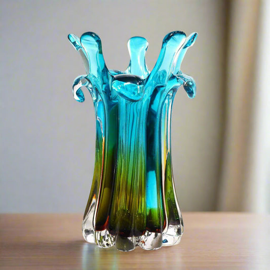 Blue and green glass vase on a white background