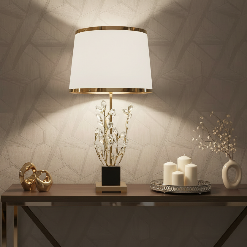 Decorative table setting with a lamp, candles, and decorative items against a textured wall.