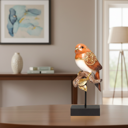 Decorative bird figurine on a stand in a room with a painting and lamp in the background.