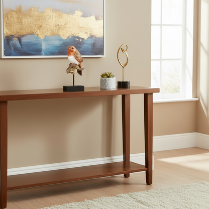 Wooden console table with decorative items against a beige wall.