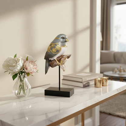 Decorative bird sculpture on a table with flowers and books in a living room setting
