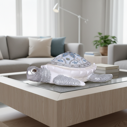 Decorative turtle figurine with blue pattern on a coffee table in a living room.