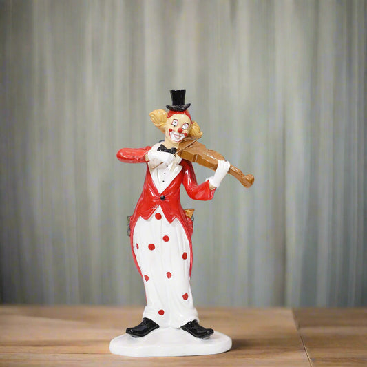 Clown figurine holding a violin against a gray background