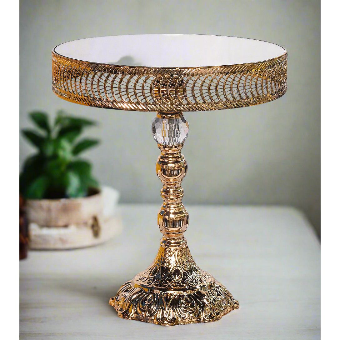 Decorative gold table with intricate design on a white background