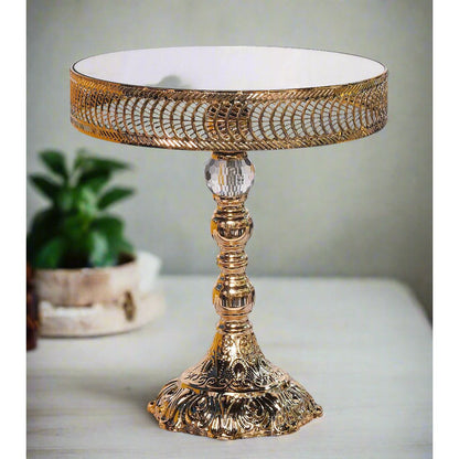 Decorative gold table with intricate design on a white background