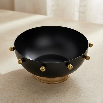 Modern Contrast: Black Metal Bowl with Gold Accents & Wood Base