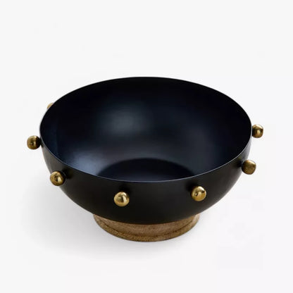 Modern Contrast: Black Metal Bowl with Gold Accents & Wood Base