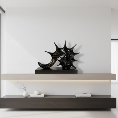 Decorative black sculpture on a modern wooden shelf against a white wall