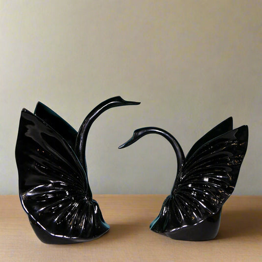 Graceful Embrace: Sculptural Black Swan Pair