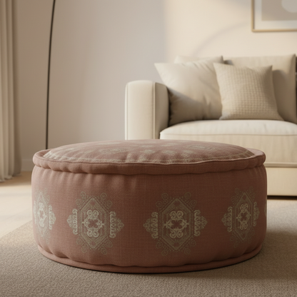 Round brown ottoman with decorative patterns in a living room setting.