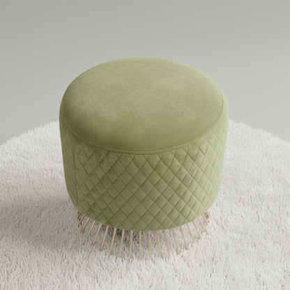 Green ottoman with woven pattern and fringe on a white surface