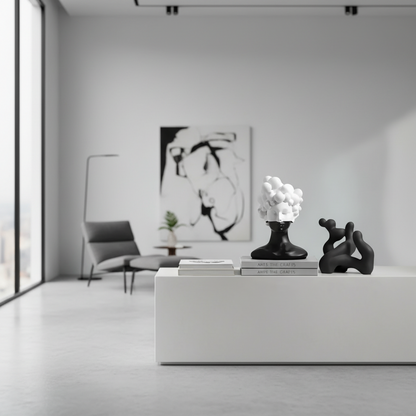 Modern interior with abstract art, sculptures, and a minimalistic design.