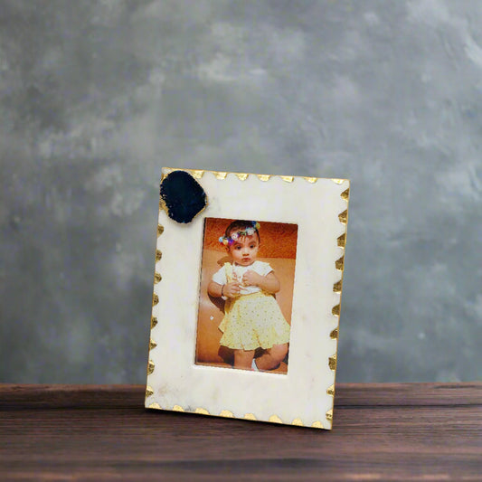 Decorative photo frame with a gold border on a white background