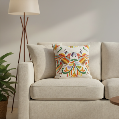 Beige sofa with a colorful decorative pillow in a living room setting.