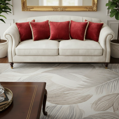 White sofa with red cushions in a living room setting