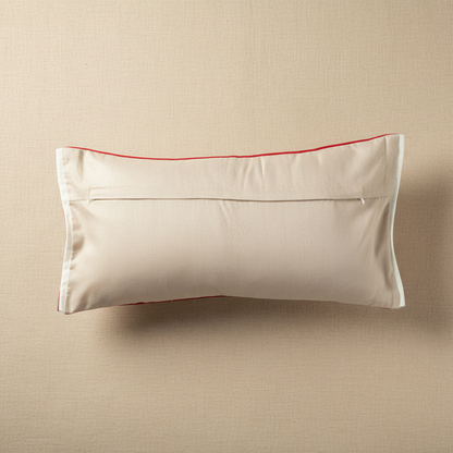 Beige pillow with red trim on a beige background