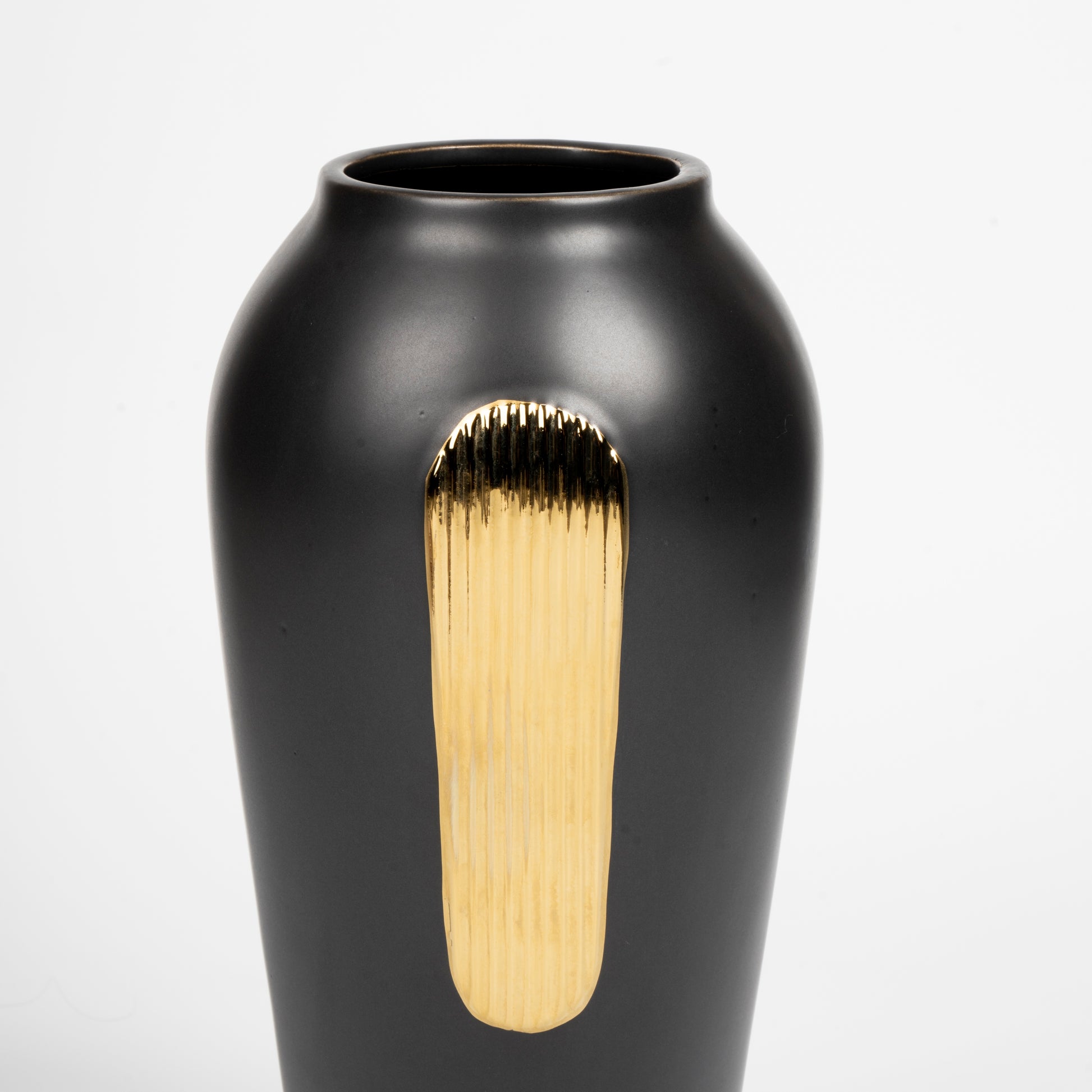 Black vase with a gold accent on a white background
