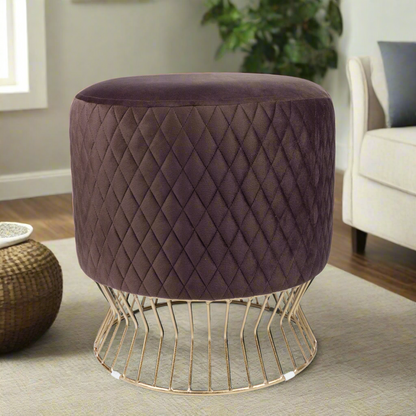 Brown quilted stool with gold wire base on a white background