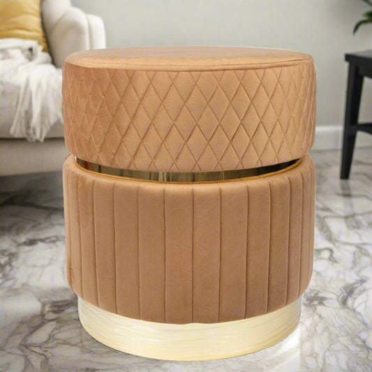 Brown quilted ottoman with gold band in a living room setting