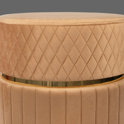 Beige quilted ottoman with a gold band on a white background