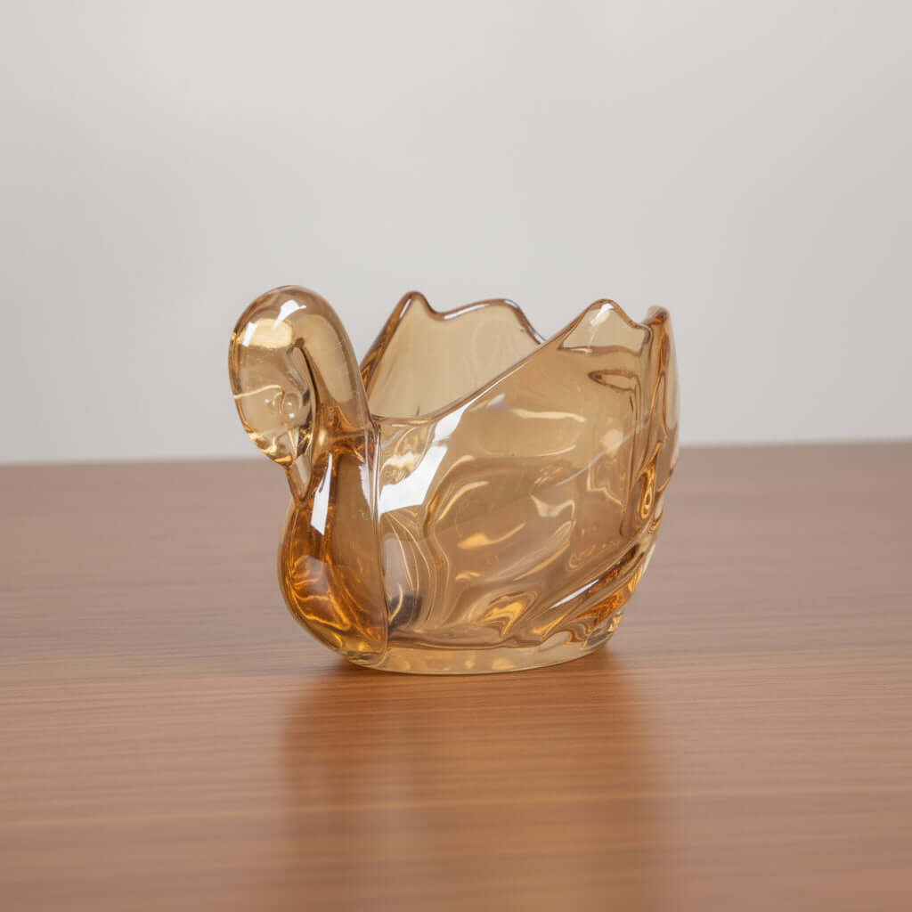 Gold-colored glass bowl on a white background