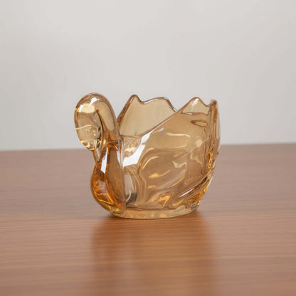 Gold-colored glass bowl on a white background