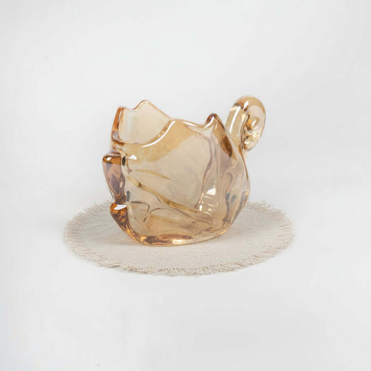 Glass cat-shaped object on a white background