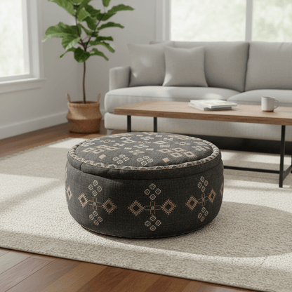 Bohemian Charcoal Handcrafted Ottoman Pouf in a cozy living room setting with geometric patterns.