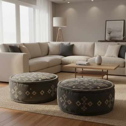Living room with a beige sectional sofa, two patterned ottomans, and a wooden coffee table.