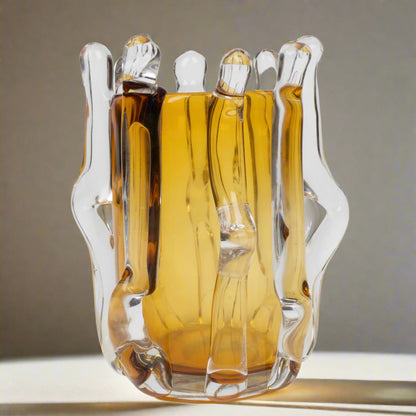 Glass decanter with a unique design on a white background