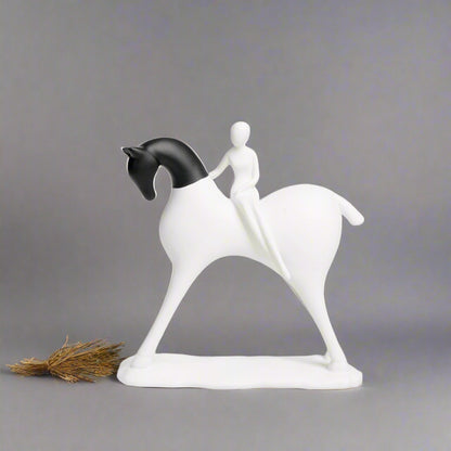 White horse figurine with a rider on a gray background