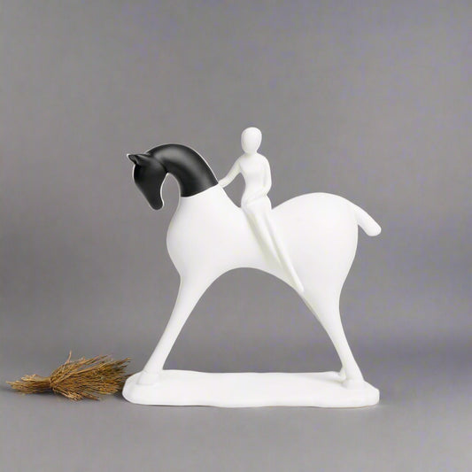 White horse figurine with a rider on a gray background
