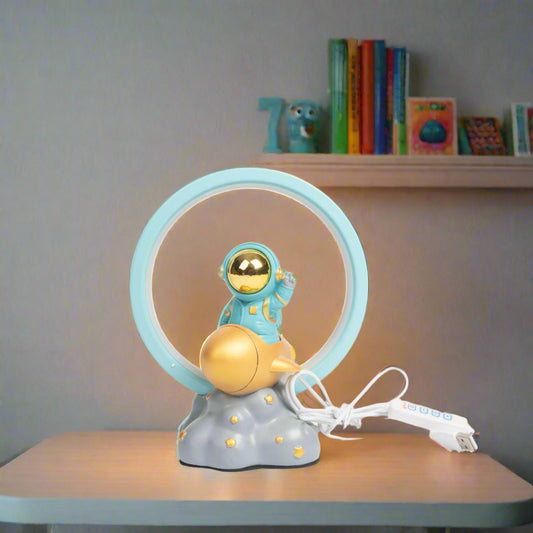 Children's lamp with astronaut design on a table