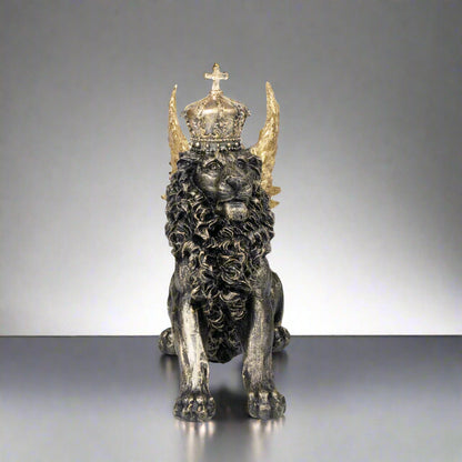 Statue of a lion with a crown and horns on a white background