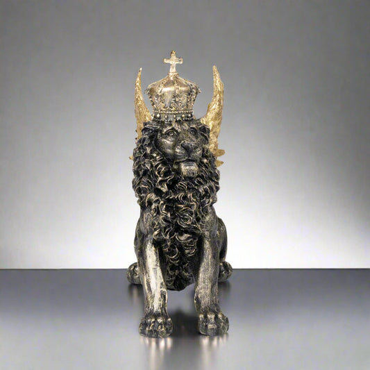 Statue of a lion with a crown and horns on a white background