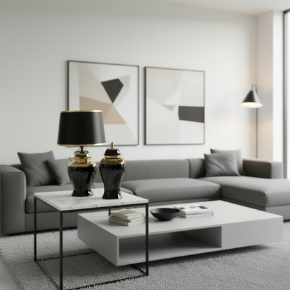 Modern living room with gray sectional sofa, white coffee table, and abstract art on the wall.