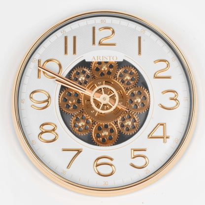 Decorative clock with gold gears and numbers on a white background
