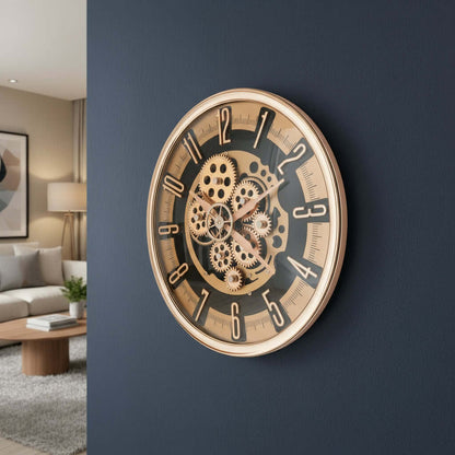 Gold mechanical wall clock on a white background