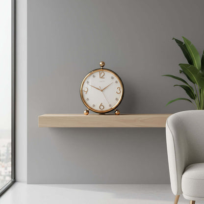 Decorative clock with gold accents on a white background