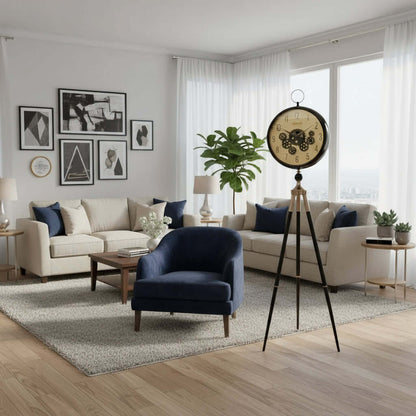 Decorative interior with a blue armchair, bookshelf, and standing clock.