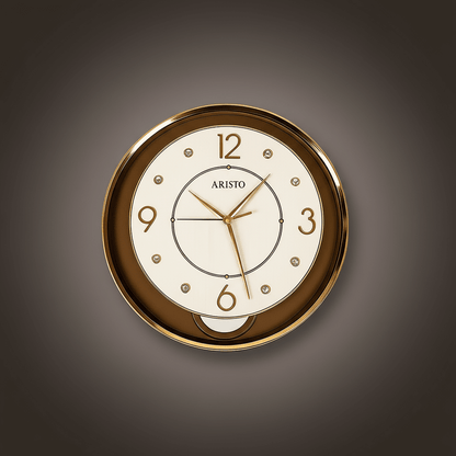 Aristo wall clock with gold casing and white face on a white background