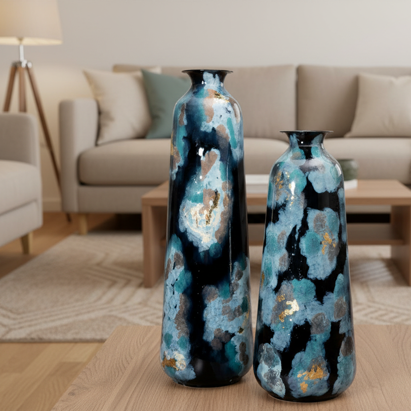 Two decorative vases with blue and black patterns on a wooden floor in a living room.
