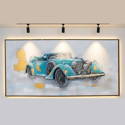 Framed artwork of a vintage blue car on a wall with lighting