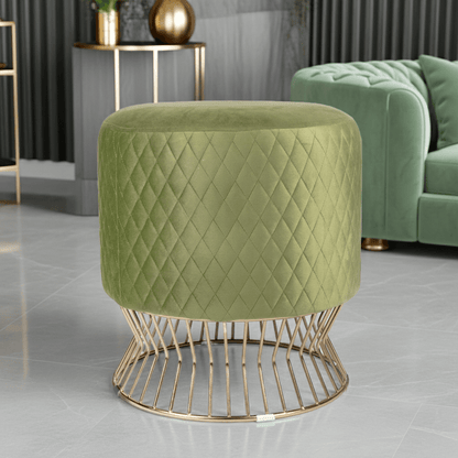 Green quilted ottoman with gold wire base in a room setting