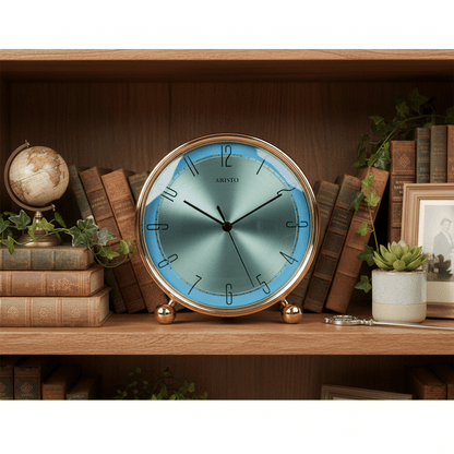 Round clock with gold frame and green face on a white background